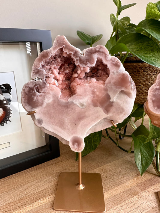 Pink amethyst geode on stand